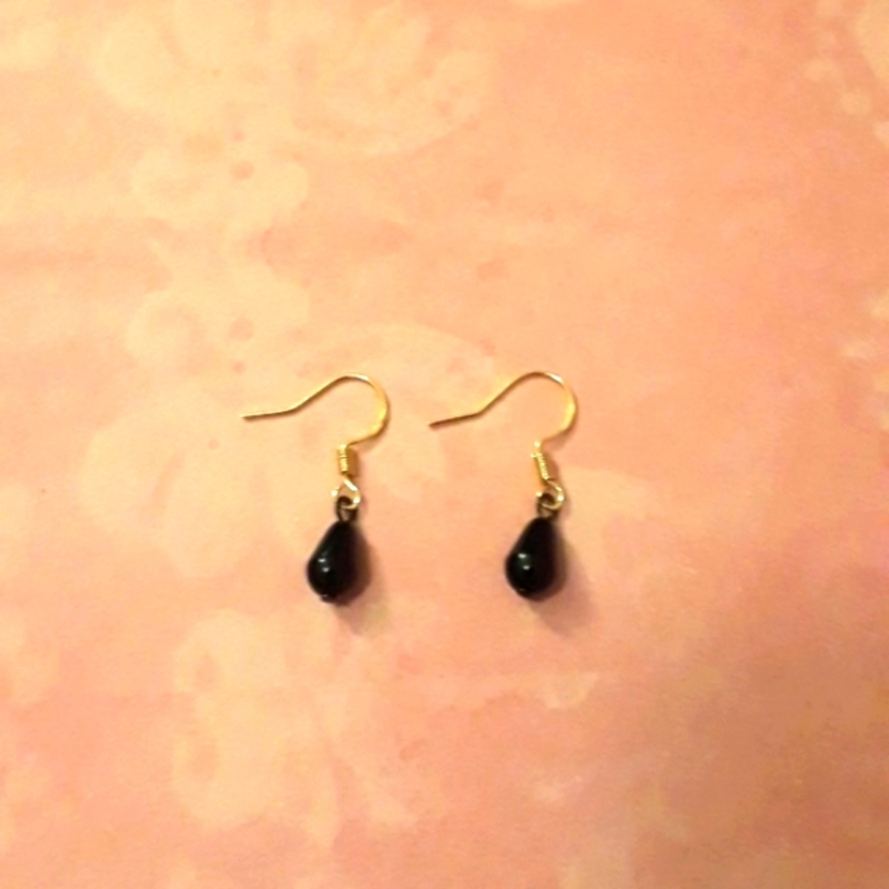 Hand Crafted Black drop earrings with 18k gold plated sterling hooks.